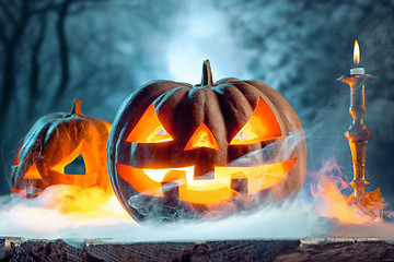 Image showing Halloween pumpkins on blue background