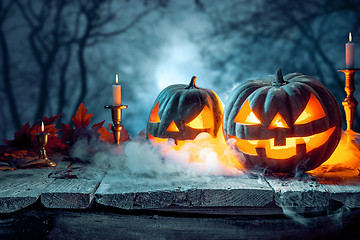 Image showing Halloween pumpkins on blue background