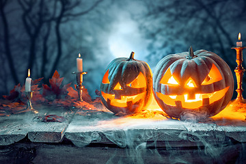 Image showing Halloween pumpkins on blue background