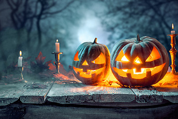 Image showing Halloween pumpkins on blue background