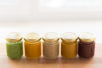 Image showing vegetable or fruit puree or baby food in jars