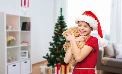 Image showing happy girl with teddy bear at christmas