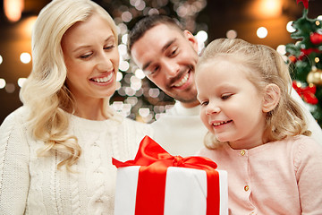 Image showing happy family at home with christmas gift box