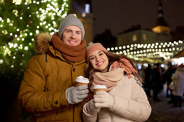 Image showing happy young couple with coffee at christmas market