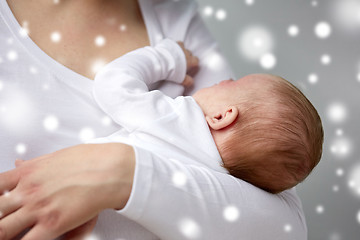 Image showing close up of mother holding newborn baby