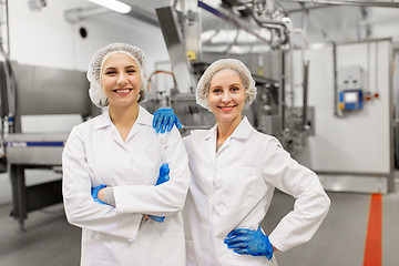 Image showing happy women technologists at ice cream factory