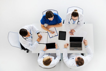 Image showing doctors with cardiogram and computers at hospital