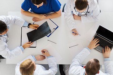 Image showing group of doctors with x-ray and laptop at clinic