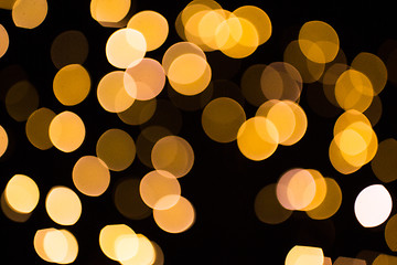 Image showing blurred golden lights over dark background