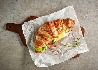 Image showing Croissant with ham and cheese