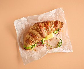 Image showing Croissant with ham and cheese