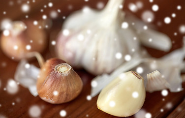 Image showing close up of garlic on wooden table