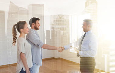 Image showing man and realtor shaking hands at new home