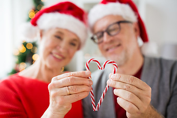 Image showing senior couple with heart of christmas candy canes