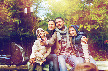 Image showing happy family with backpacks hiking