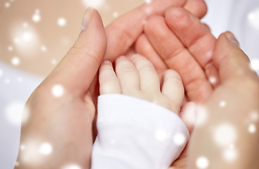 Image showing close up of mother and newborn baby hands