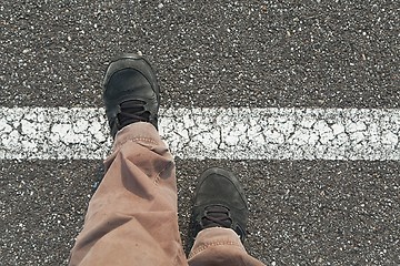 Image showing Stepping over the line