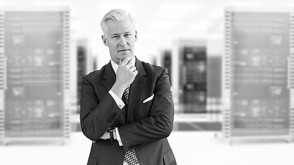 Image showing Senior businessman in server room