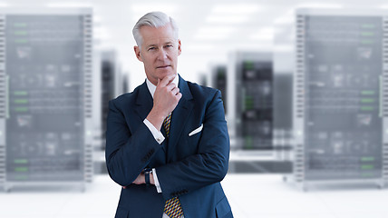 Image showing Senior businessman in server room