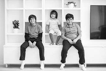 Image showing young boys posing on a shelf