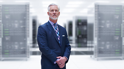 Image showing Senior businessman in server room