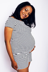 Image showing young pretty african american woman pregnant happy smiling, posing on white background isolated , lifestyle people concept copyspace