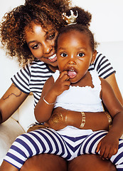 Image showing adorable sweet young afro-american mother with cute little daugh