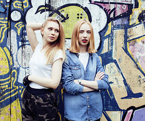 Image showing two cool blond real girls friends making selfie on roof top, lif