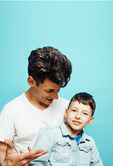Image showing young pretty man model with little cute son playing together, lifestyle modern people concept, family male 