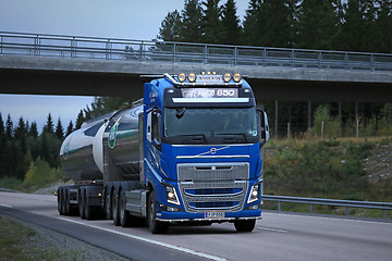 Image showing Blue Volvo FH Milk Tanker and Highway Bridge