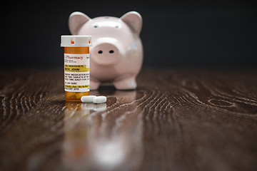 Image showing Non-Proprietary Prescription Medicine Bottle, Pills and Piggy Ba