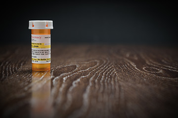 Image showing Non-Proprietary Prescription Medicine Bottle on Reflective Woode