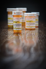 Image showing Variety of Non-Proprietary Prescription Medicine Bottles on Refl