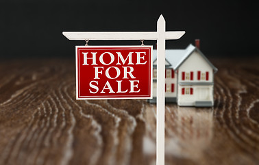 Image showing For Sale Real Estate Sign In Front of Model Home on Reflective W