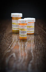 Image showing Variety of Non-Proprietary Prescription Medicine Bottles on Refl