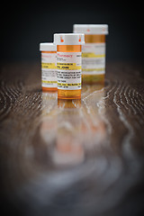 Image showing Variety of Non-Proprietary Prescription Medicine Bottles on Refl