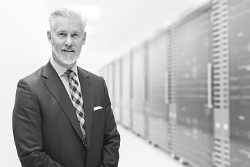 Image showing Senior businessman in server room