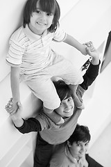 Image showing young boys posing line up piggyback top view