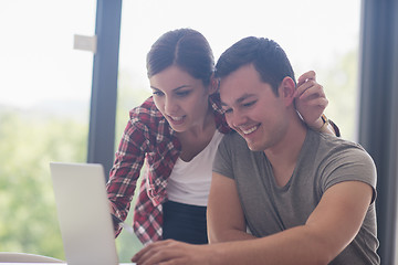 Image showing happy young couple buying online