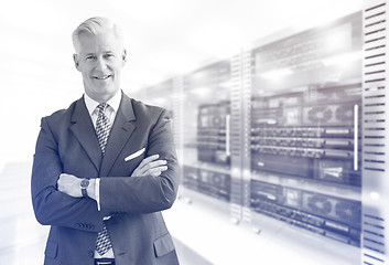 Image showing Senior businessman in server room