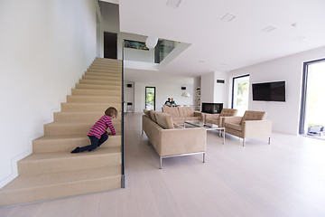 Image showing family with little girl enjoys in the modern living room