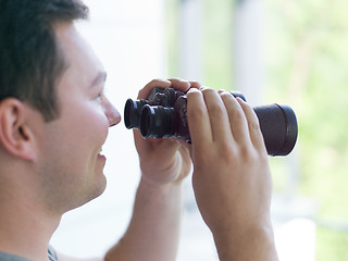 Image showing man looking with binoculars