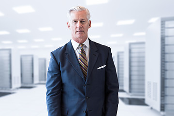 Image showing Senior businessman in server room