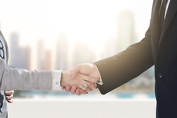 Image showing business man and woman handshake on  meeting