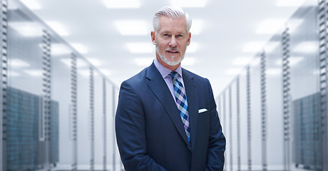 Image showing Senior businessman in server room