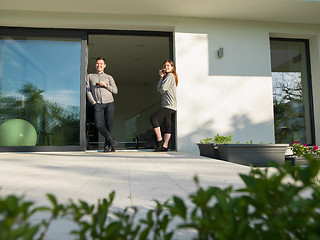 Image showing couple enjoying on the door of their luxury home villa