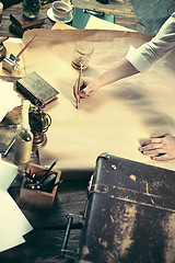 Image showing Architect working on drawing table in office