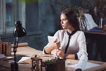 Image showing Young beautiful woman working with laptop