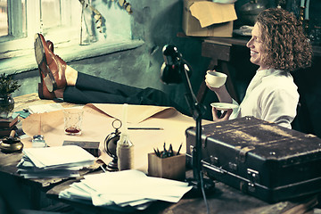 Image showing Architect working on drawing table in office