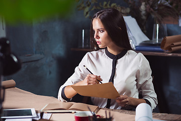 Image showing Young beautiful woman working with laptop
